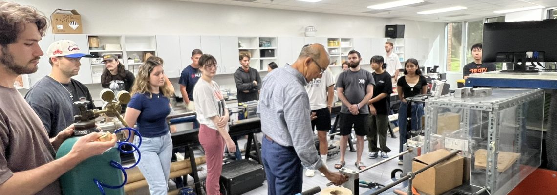 Capstone students in the LDRAM learning from Dr. Subhash about Split Hopkins Pressure Bars.