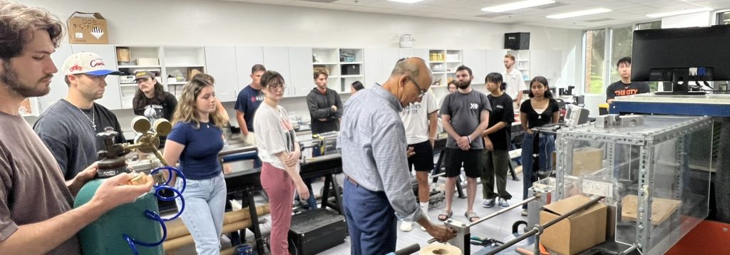 Capstone students in the LDRAM learning from Dr. Subhash about Split Hopkins Pressure Bars.